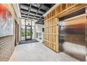 Stylish building lobby with elevator and wood wall accents at 3575 Chestnut Pl # 403, Denver, CO 80216