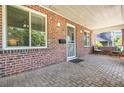 Brick porch with seating area at 1538 Oneida St, Denver, CO 80220