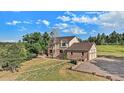 Two-story home with a large yard and attached garage at 102 Staghorn Way, Franktown, CO 80116