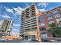 High-rise building in urban setting, showcasing its modern design and architecture at 2020 Arapahoe St # 950, Denver, CO 80205