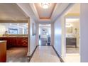 Elegant entryway with hardwood floors, and views into living room and bathroom at 1891 Curtis St # 1716, Denver, CO 80202