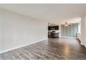 Spacious living area with hardwood floors and an open floor plan at 909 N Logan St # 4A, Denver, CO 80203