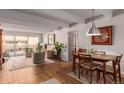 Living and dining area with hardwood floors and balcony access at 8060 E Girard Ave # 719, Denver, CO 80231