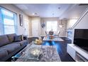 Open living area with hardwood floors, modern furniture, and ample natural light at 11255 E 25Th Ave, Aurora, CO 80010