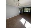 Spacious dining area with hardwood floors and access to kitchen at 15626 Greenstone Cir, Parker, CO 80134