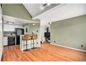 Kitchen with black appliances and a breakfast bar at 8701 Huron St # 1-210, Thornton, CO 80260