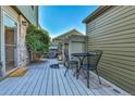 Private patio with bistro table and chairs at 3407 S Ammons St # 20-2, Lakewood, CO 80227