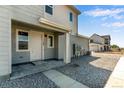 Exterior view of townhome with front entry and walkway at 1783 Mount Meeker Ave, Berthoud, CO 80513