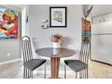 Small dining area with granite table and modern chairs at 12474 W Nevada Pl # 211, Lakewood, CO 80228