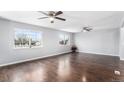 Bright living room featuring hardwood floors and neutral walls at 206 Cedar St, Hudson, CO 80642