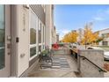 Inviting front porch with seating and a modern design at 2874 W Parkside Pl, Denver, CO 80221