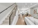 Modern staircase with metal railing leading to upper level at 2874 W Parkside Pl, Denver, CO 80221