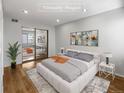 Virtually staged bedroom with hardwood floors and mirrored closet doors at 1830 Newland Ct # 323, Lakewood, CO 80214