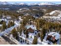 Aerial view showcasing log cabin and mountain landscape at 878 American Way, Breckenridge, CO 80424