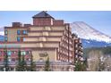 Exterior view of a building with mountain backdrop at 535 S Park Ave # 206, Breckenridge, CO 80424