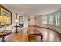 Spacious living room with hardwood floors and fireplace at 12000 W 29Th Pl, Wheat Ridge, CO 80215