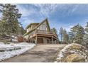 A-frame home with wrap around deck and mountain views at 5879 High Dr, Evergreen, CO 80439