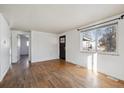 Bright living room with hardwood floors and access to other rooms at 2756 W Iowa Ave, Denver, CO 80219