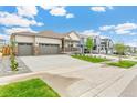 Ranch style home with a two car garage and landscaped yard at 4769 Windmill Dr, Brighton, CO 80601