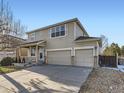 Two-story house with a three-car garage and a well-maintained yard at 5035 Bayou Gulch St, Parker, CO 80134