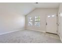 Bright living room with neutral carpeting and large windows at 1758 Eagle St # C, Aurora, CO 80011