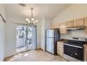 Bright kitchen with stainless steel appliances and light wood cabinets at 1758 Eagle St # C, Aurora, CO 80011