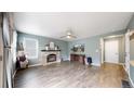 Living room with fireplace and hardwood floors at 9866 Spring Hill Ln, Highlands Ranch, CO 80129