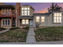 Two-story townhome with brick exterior and a landscaped yard at 1100 S Waco St # G, Aurora, CO 80017