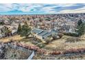 Wide lot with a mid-century home and distant city views at 34 S Raleigh St, Denver, CO 80219