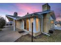 Mid-century modern home showcasing a large window and patio at 34 S Raleigh St, Denver, CO 80219