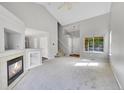 Bright living room with vaulted ceilings, fireplace and hardwood floors at 19873 E Vassar Ave, Aurora, CO 80013
