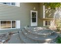 House's front entrance with steps leading to the door at 6352 S Johnson St, Littleton, CO 80123