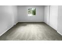 Spacious bedroom with neutral carpeting and large window at 5670 S Lowell Blvd, Littleton, CO 80123