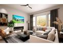 Bright living room with fireplace and large windows at 1821 Grayside Cir, Castle Rock, CO 80109