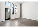 Bright and airy bedroom with large windows and polished concrete floors at 1601 Park Ave # 110, Denver, CO 80218