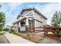 Two-story Craftsman home with gray siding and front porch at 16911 Buffalo Valley Path, Monument, CO 80132