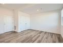 Bright bedroom with double door closet and wood-look floors at 370 N. Geneva St, Aurora, CO 80010