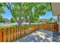 Private patio area with wood fence and street view at 6885 E Arizona Avenue # D, Denver, CO 80224