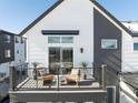 Private balcony with wicker chairs and plants offering relaxing views at 2878 S Pancratia St, Denver, CO 80236