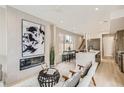 Open living room showcasing a fireplace and modern furniture at 2313 S High St, Denver, CO 80210