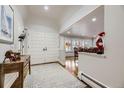 Bright entryway with hardwood floors and double doors at 7000 S Sheridan Blvd, Littleton, CO 80128