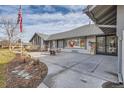Concrete patio with seating area and landscaping at 7000 S Sheridan Blvd, Littleton, CO 80128