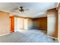 Spacious carpeted bedroom with ceiling fan and double closets at 62 S Holman Way # 62, Golden, CO 80401