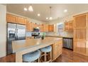 Modern kitchen with stainless steel appliances and island at 6280 Indian Paintbrush St, Frederick, CO 80530