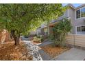 Townhouse exterior with walkway and landscaping at 134 W Sterne Pkwy, Littleton, CO 80120