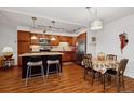 Modern kitchen with stainless steel appliances and island at 725 S Alton Way # 3B, Denver, CO 80247