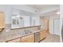 Kitchen with breakfast bar and ample counter space at 7931 W 55Th Ave # 112, Arvada, CO 80002