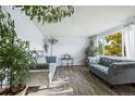 Bright living room with hardwood floors, two sofas, and ample natural light at 4963 Billings St, Denver, CO 80239