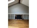 Fireplace, built-in shelves, and hardwood floors in this Gathering room at 2889 S Newark Pl, Aurora, CO 80014