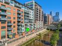 Waterside Lofts building with riverfront views and modern architecture at 1401 Wewatta St # 214, Denver, CO 80202